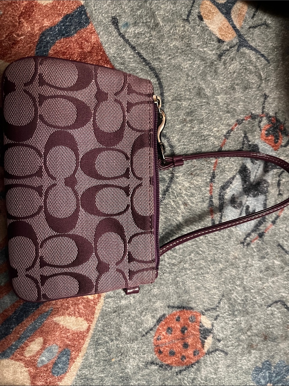 Coach Plum Signature Canvas wristlet